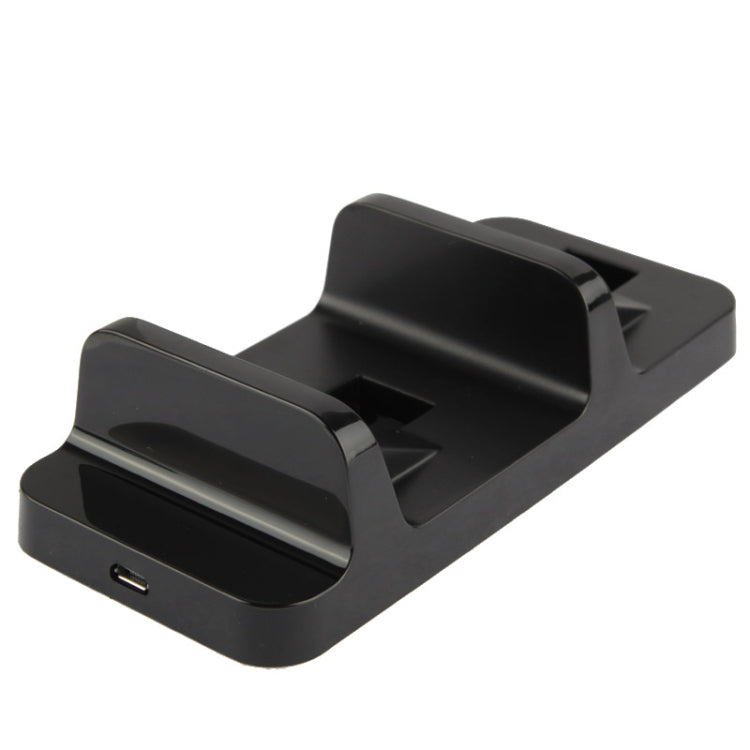 Black charging dock base with front USB port and two controller slots