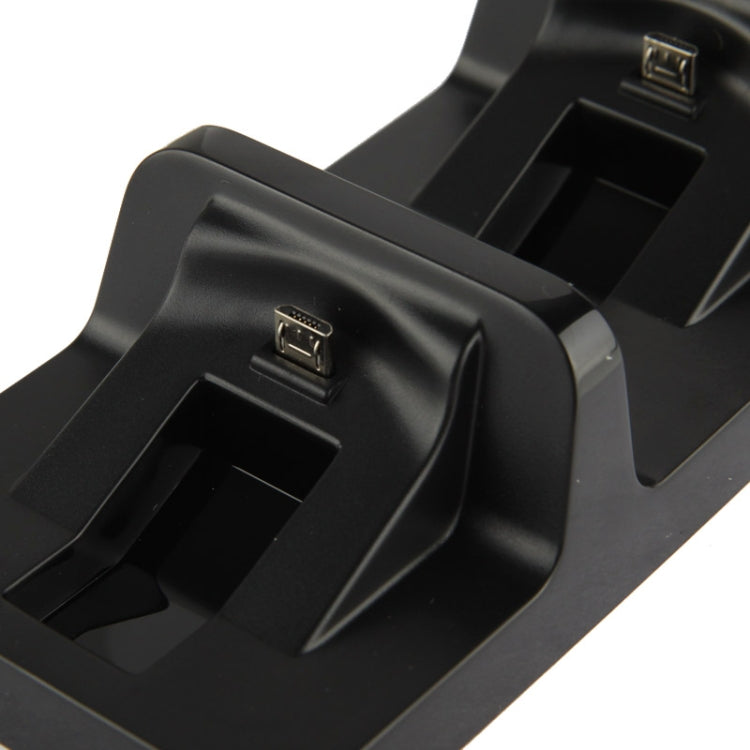 Close-up of black dual charging dock connectors on two controller bays