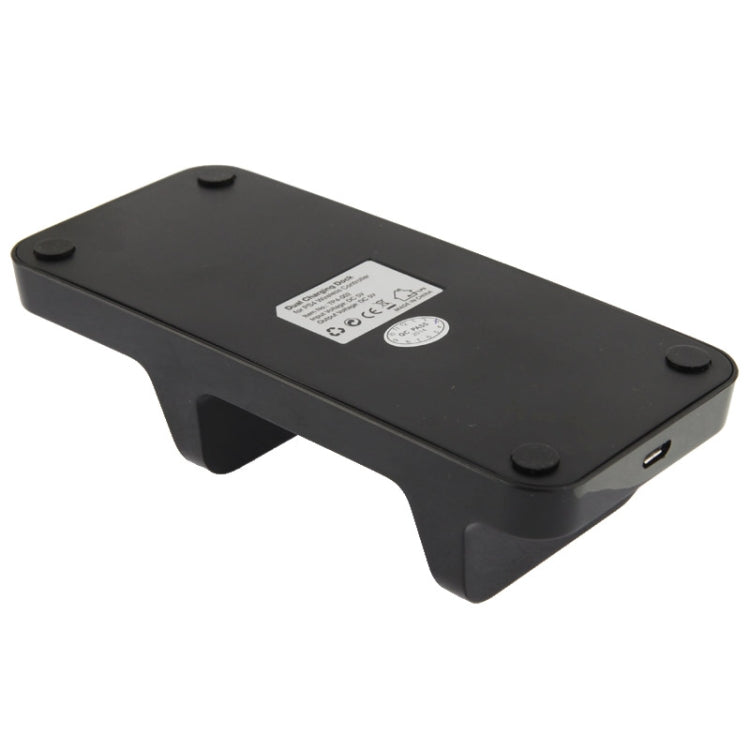 Bottom view of black dual charging dock with label and rubber feet