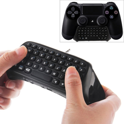 Black wireless mini keyboard for game controller, showing QWERTY keys and control buttons
