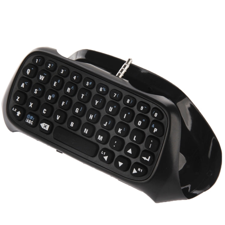 Black wireless mini keyboard with QWERTY keys and metal plug on top edge