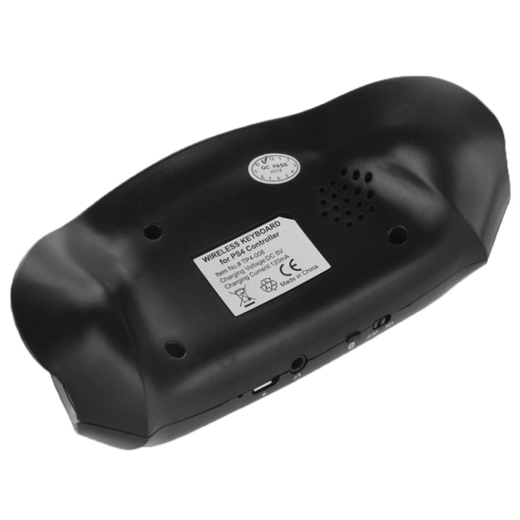 Black wireless mini keyboard back with speaker holes and regulatory label