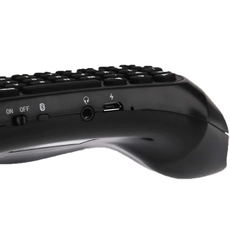 Black wireless mini keyboard side view with power switch and USB port