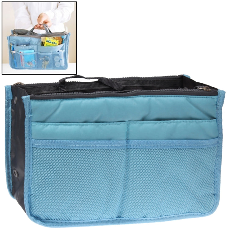 Light blue double-zip cosmetic bag with front compartments and mesh pocket.