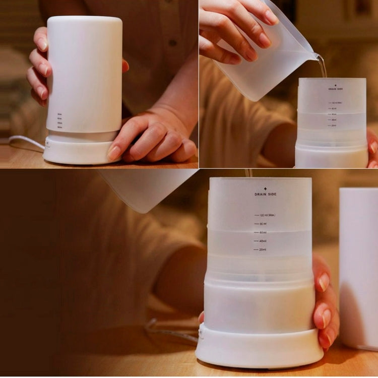 White aroma diffuser humidifier being filled with liquid by hand