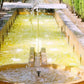 Solar pump in outdoor water basin with mesh channels and flowing water