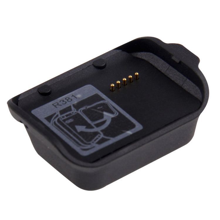 Black charging dock with R381 label and charging contact pins