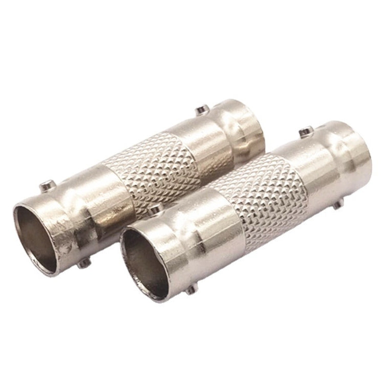 BNC inline splice with two silver cylindrical BNC jacks and knurled grip sections