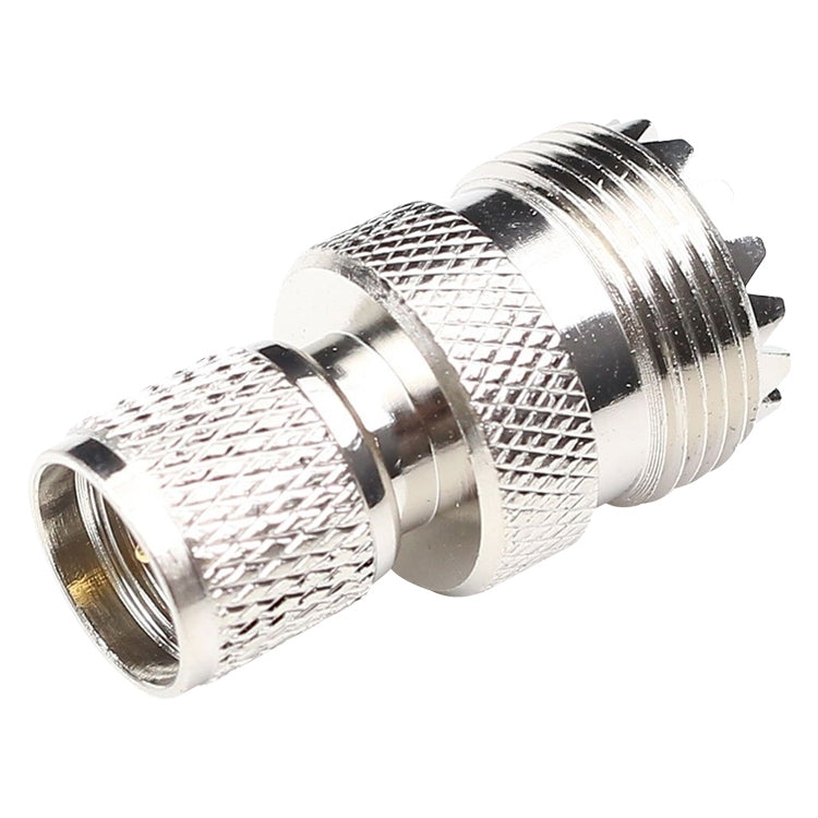 Metal RF coax connector with knurled grip, UHF male and female ends, gold contact