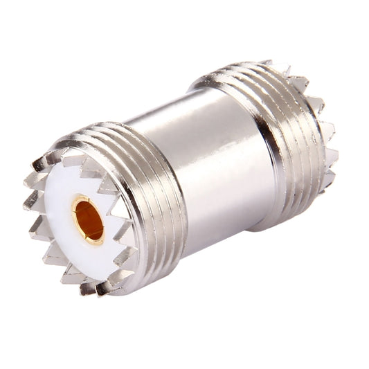 Silver UHF female-to-female RF connector, two threaded ports with gold inner contact