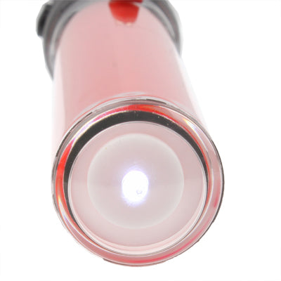 Front lens of red LED baton flashlight with bright central LED