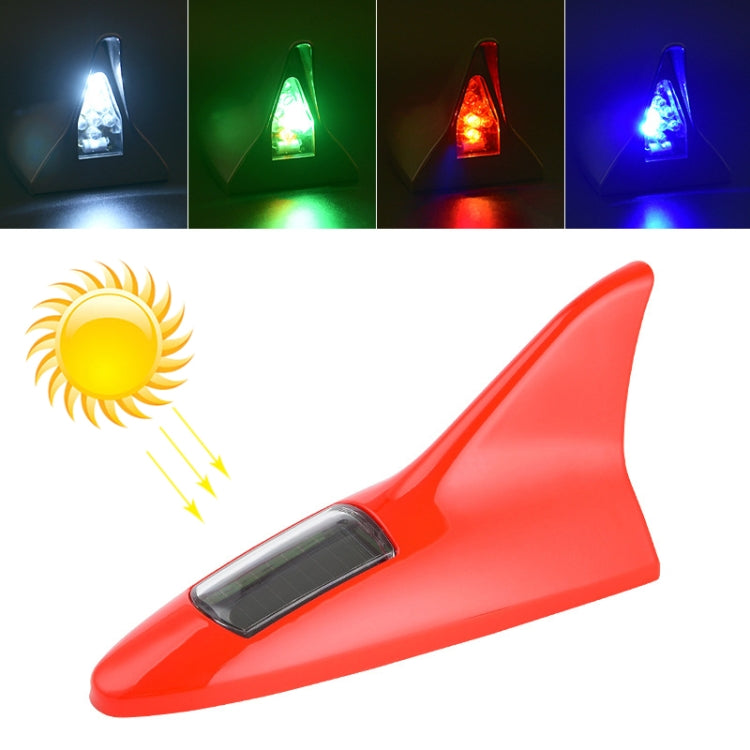Solar shark fin alarm light with red body and clear LED lens on top