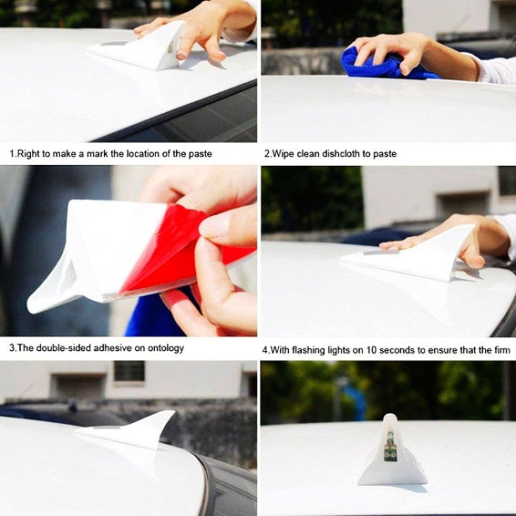 Hands installing a solar shark fin alarm light using adhesive on a car surface