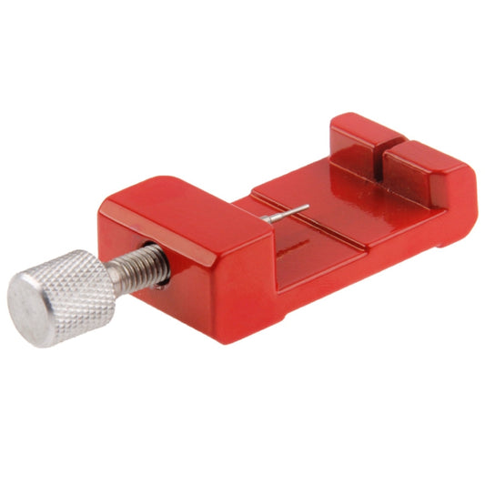Red watch strap link pin remover tool with textured grip knob and spring rod