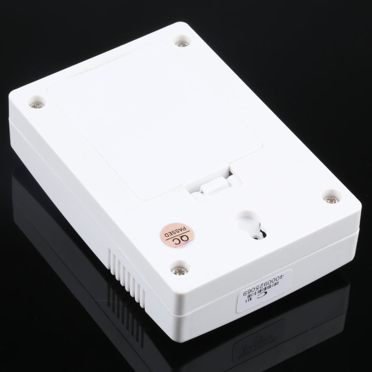 VOYE wireless doorbell remote with battery compartment and screws on white casing