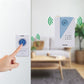 Hand pressing wireless doorbell remote with chime unit on wall
