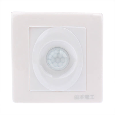 White wall human motion sensor switch with circular PIR lens in square faceplate