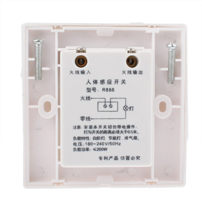 White wall motion sensor switch interior with screw terminals and wiring diagram