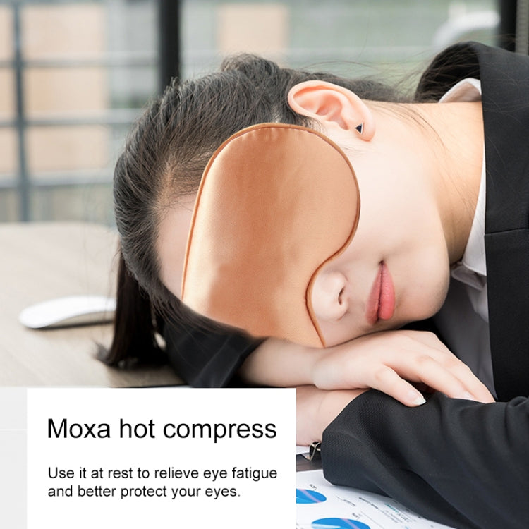 Orange satin heated sleep eye mask worn while resting