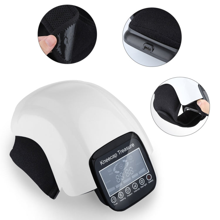 White knee massager with black strap pads and small control unit, side view detail