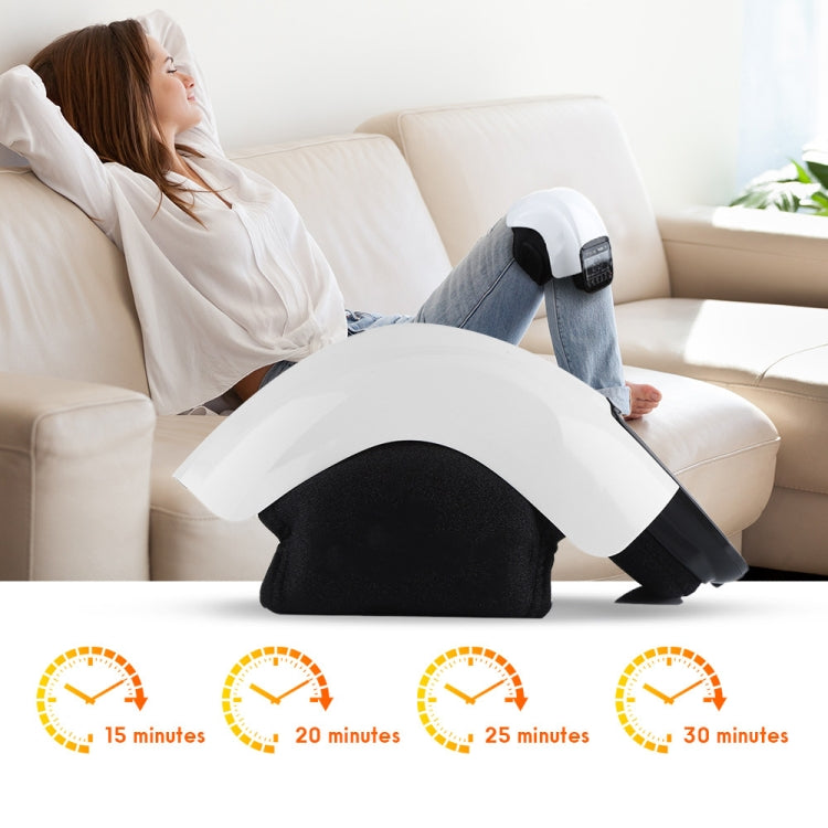 Infrared knee massager wrap on leg with white cover and black heated controller unit