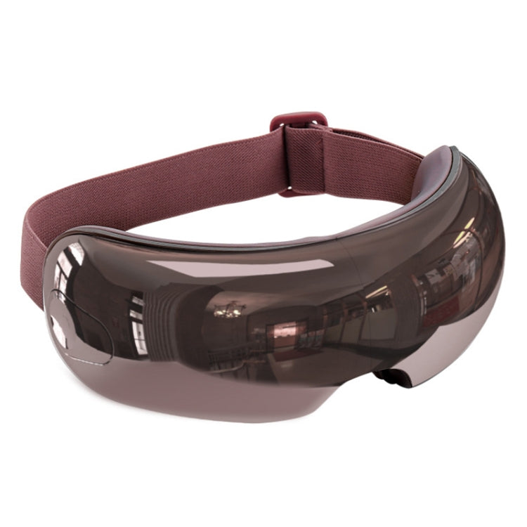 Dark smoke eye massager with maroon fabric strap and glossy curved visor.
