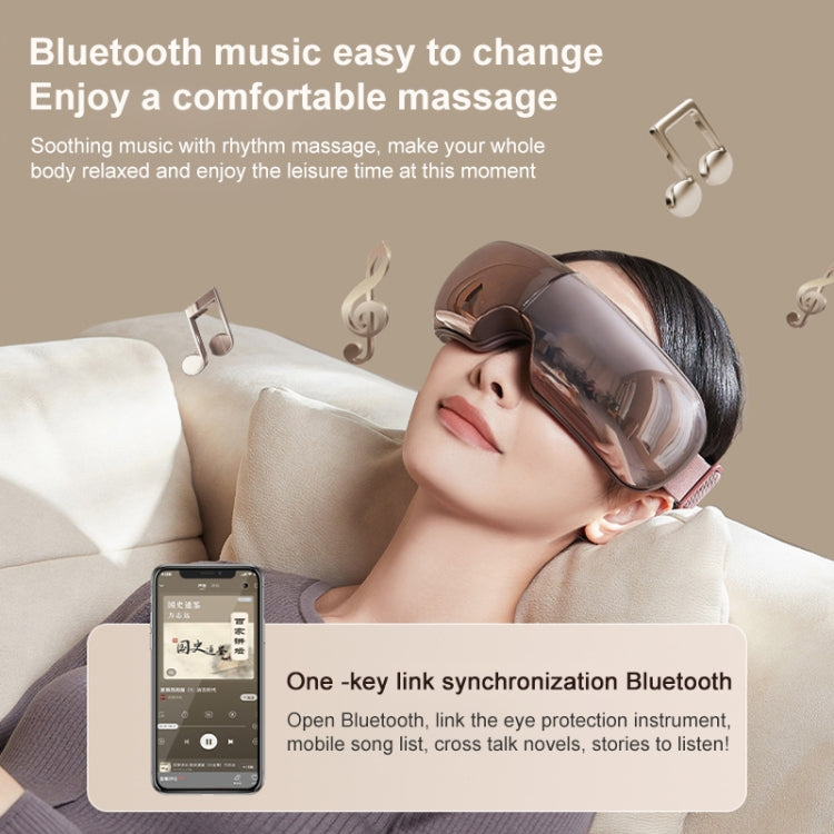 Eye massager worn over closed eyes with dark visor and padded head strap.