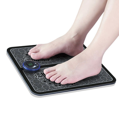 Black EMS microcurrent foot massage pad with round controller under two feet