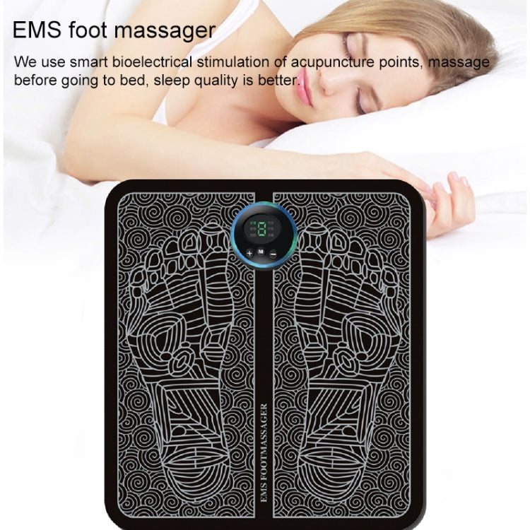 Black patterned EMS foot massage pad with blue display controller