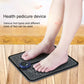 Black EMS foot massage pad with round controller and feet placed on top