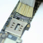 Pig hair brush bristles cleaning a circuit board surface
