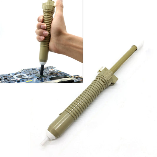 Solder suction tin pump tool with needle tip, held in hand over circuit board