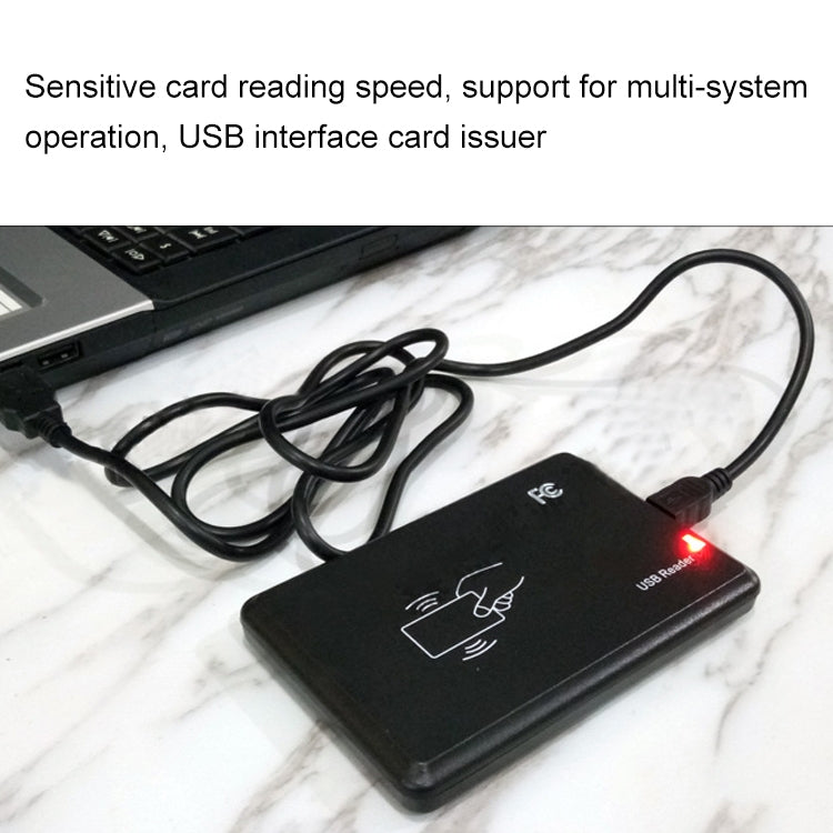 Black USB RFID card reader with connected cable and illuminated status LED