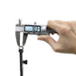 Carbon steel compass caliper tool in hand, digital caliper measuring close