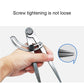 Head spacing compass tool held in hand, black knob locked to frame