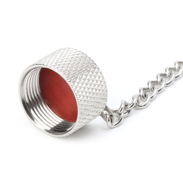 Close-up of textured threaded RF dust cap with red inner seal on chain