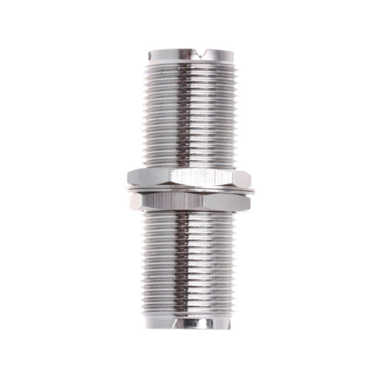 UHF female-to-female connector adapter, side view of two silver threaded connectors