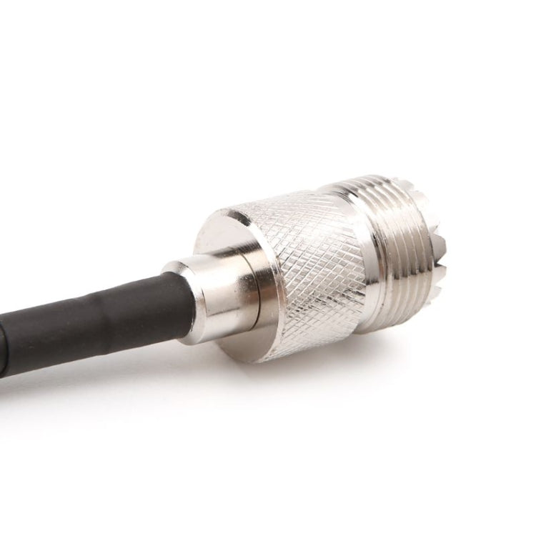Metal SMA female connector coupling on RG58 coaxial cable, black jacket.