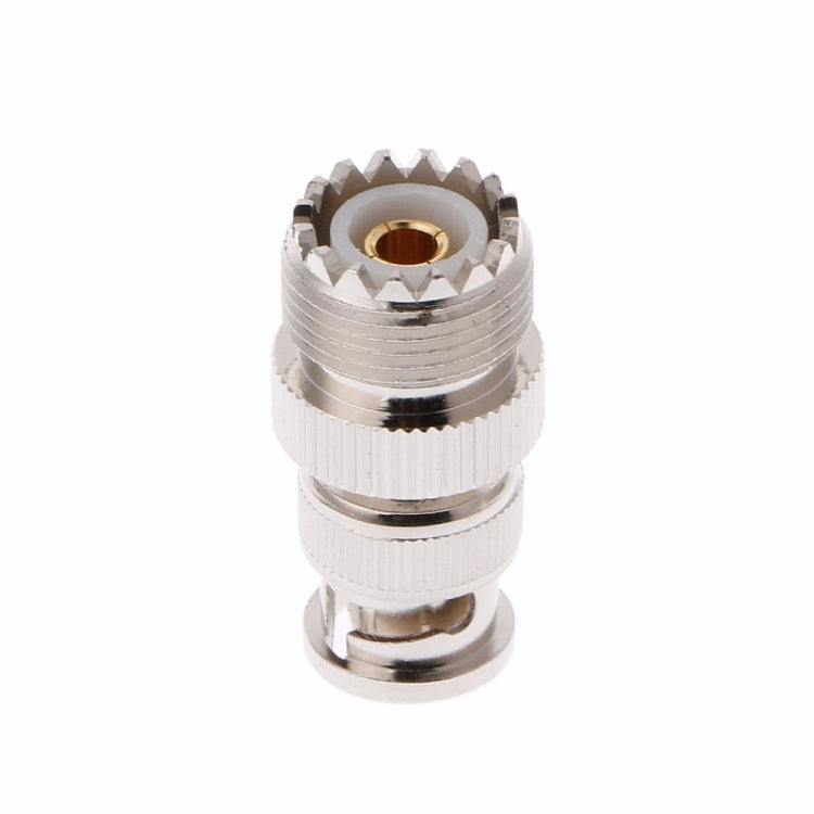 UHF SO-239 RF adapter end view, silver threaded housing with exposed gold contact