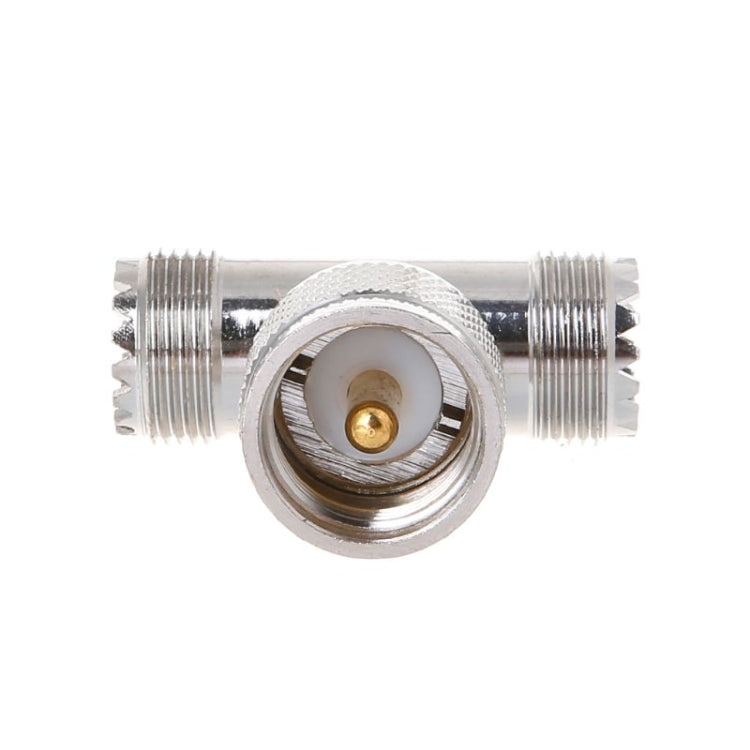 UHF RF T-adapter end view, silver metal with central UHF female socket and male port