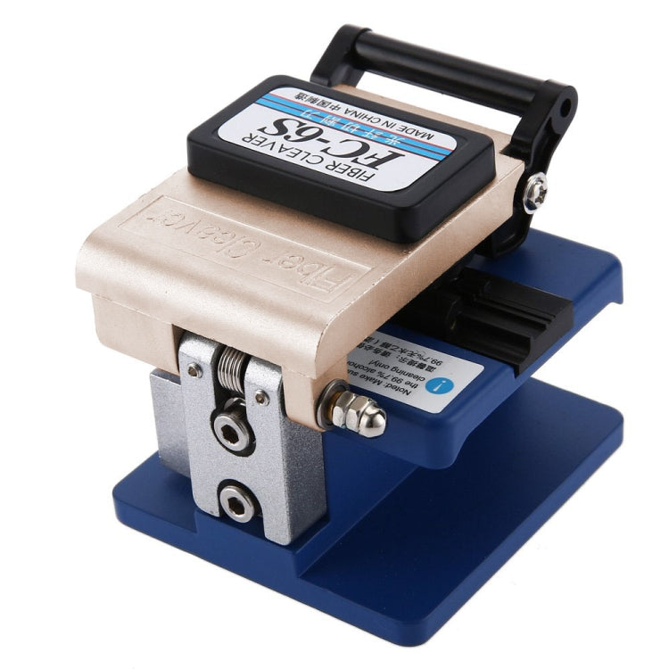 Optical fiber cleaver tool with beige housing and blue platform, black top cover handle