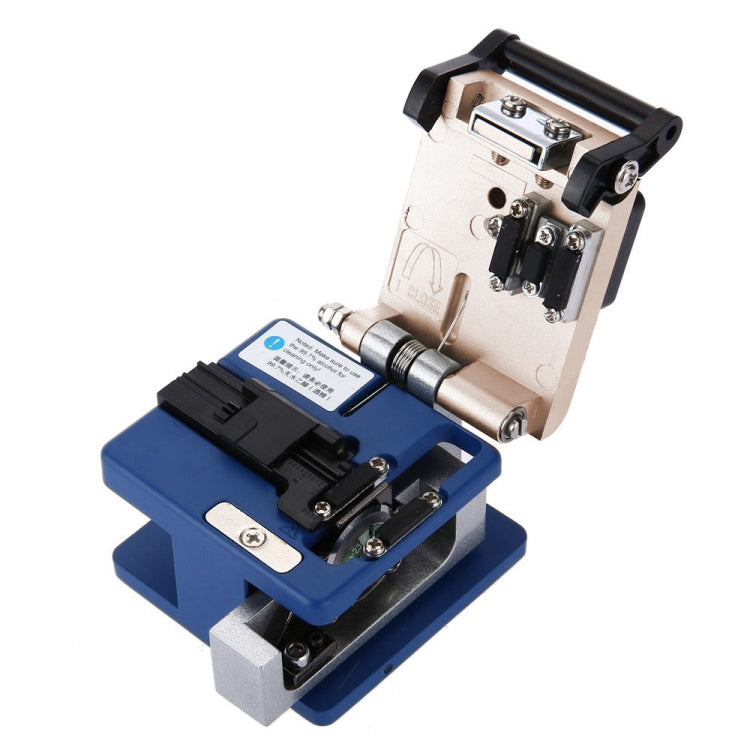 Optical fiber cleaver with open blade area, beige body and blue base, metal adjustment parts
