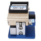 Optical fiber cleaver close-up with black top bar, beige housing and blue platform