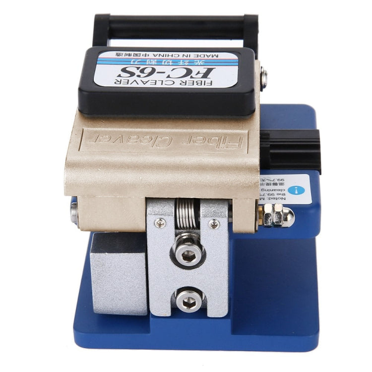 Optical fiber cleaver close-up with black top bar, beige housing and blue platform