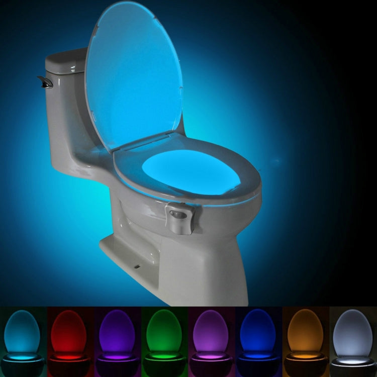 Blue LED toilet nightlight with motion sensor, mounted on open toilet lid