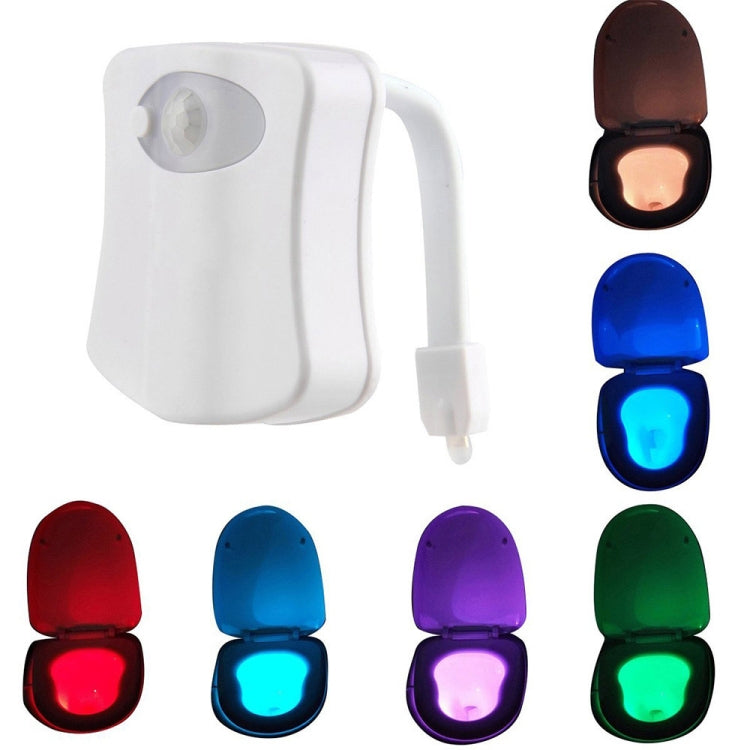 Motion-activated LED toilet nightlight set in multiple colors with plug-in power