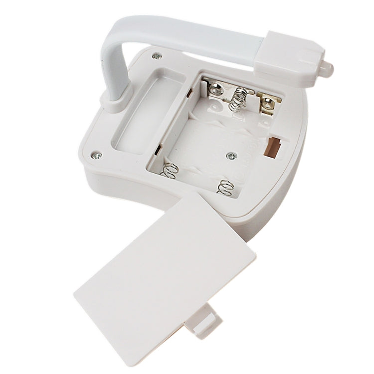Motion-activated toilet nightlight with open battery compartment and switch terminals