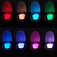 LED toilet nightlight showing different color glows across open toilet lid