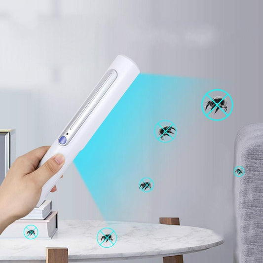 Handheld white UV germicidal lamp stick with blue indicator light, held in hand