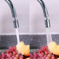 Chrome faucet spout bubbler with two water streams over sink drain area